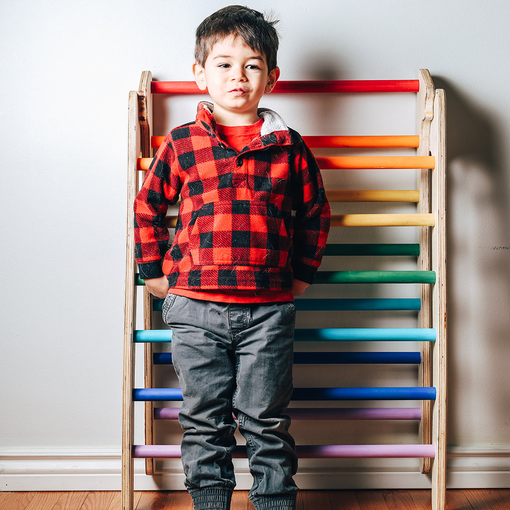 child with rainbow wooden Folding Climbing Triangle